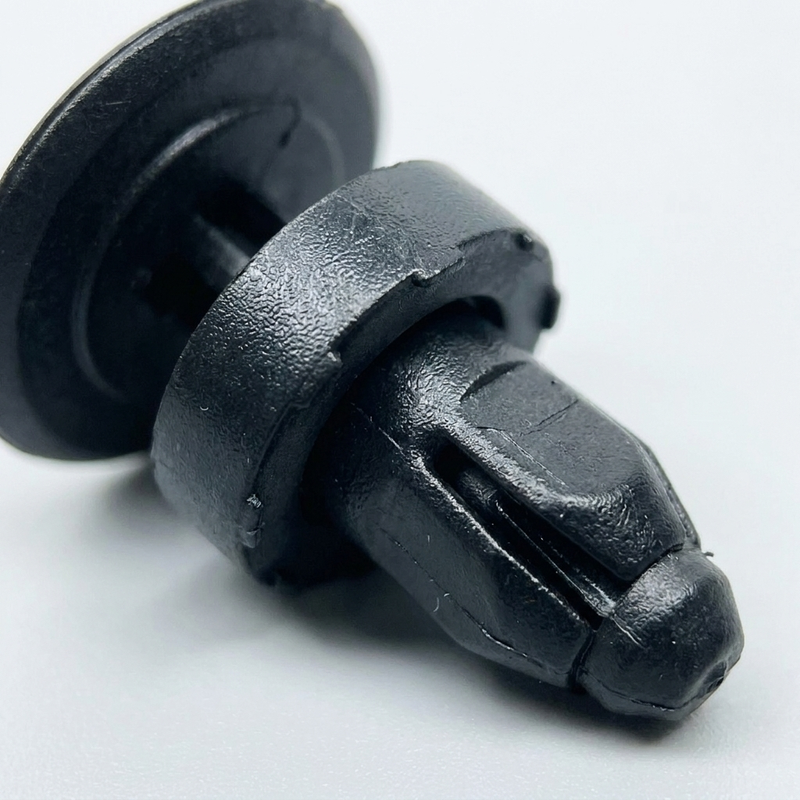 Honda Cowl Panel Retainer 91508-SR3-000 — macro detail of expansion legs and drive pin